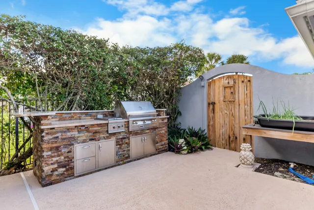 an aerial view of a house with outdoor space
