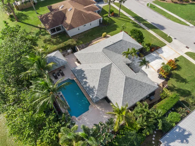 an aerial view of residential houses with outdoor space