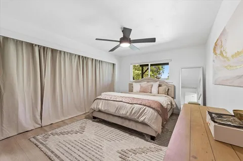 a bedroom with a bed and a couch