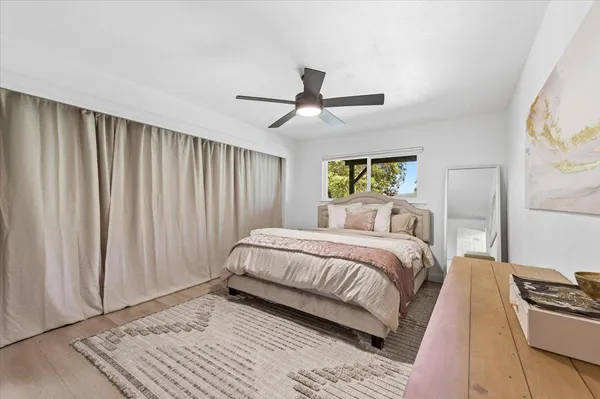 a bedroom with a bed and a couch