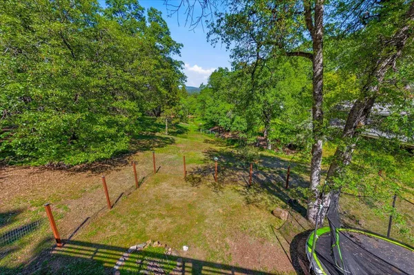 a view of a swimming pool with a table and chairs