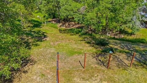 a backyard of a house with lots of green space