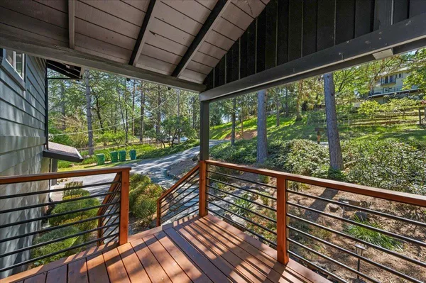 a view of balcony with wooden floor