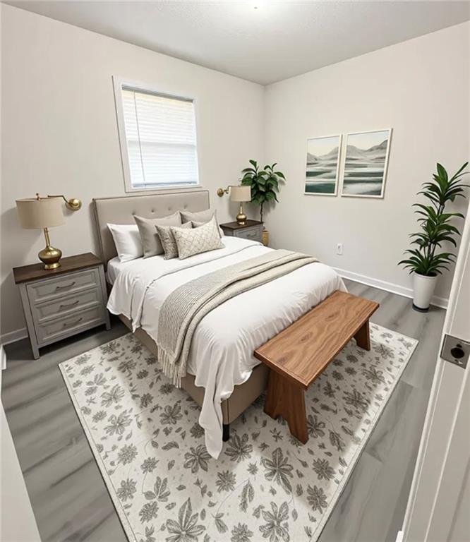 554 Fort Street Northeast Marietta, GA 30060 - Photo 12 of 15 a bed sitting in a bedroom next to a window