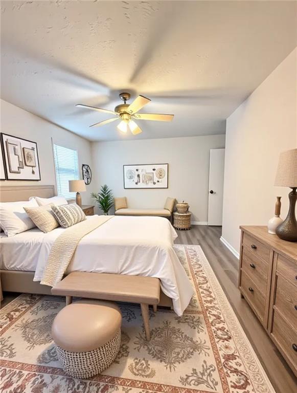 554 Fort Street Northeast Marietta, GA 30060 - Photo 13 of 15 a spacious bedroom with a bed and a chandelier