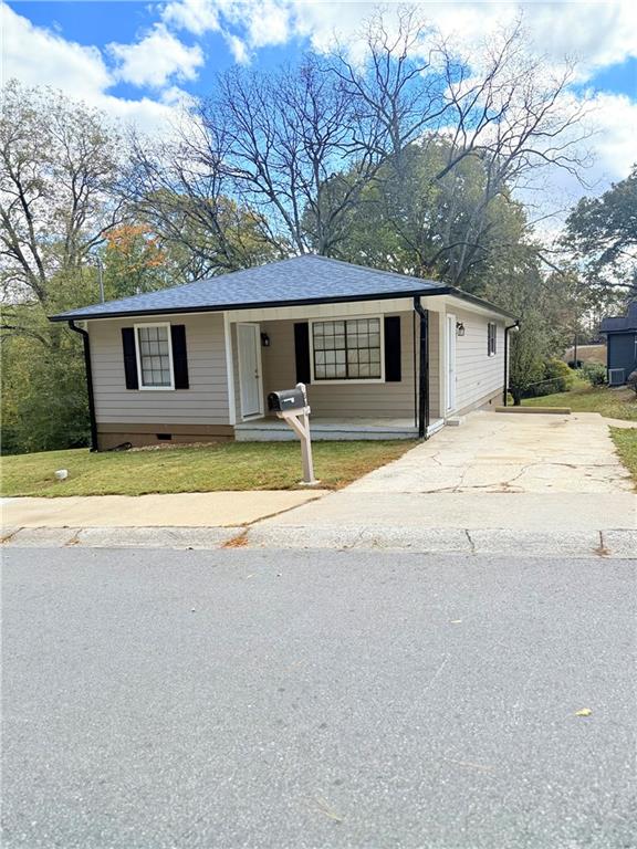 554 Fort Street Northeast Marietta, GA 30060 - Photo 2 of 15 a house that has a tree in front of it