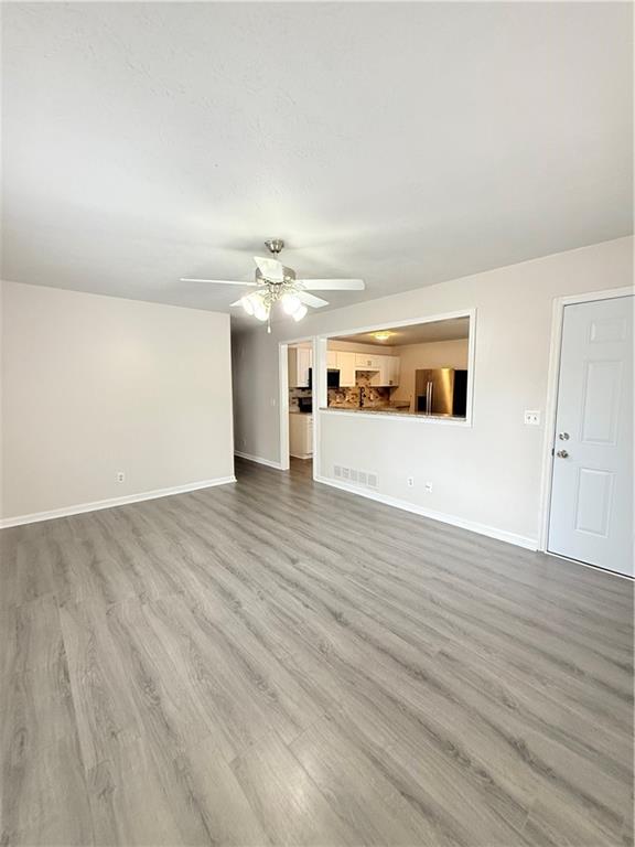 554 Fort Street Northeast Marietta, GA 30060 - Photo 6 of 15 a view of a livingroom with wooden floor