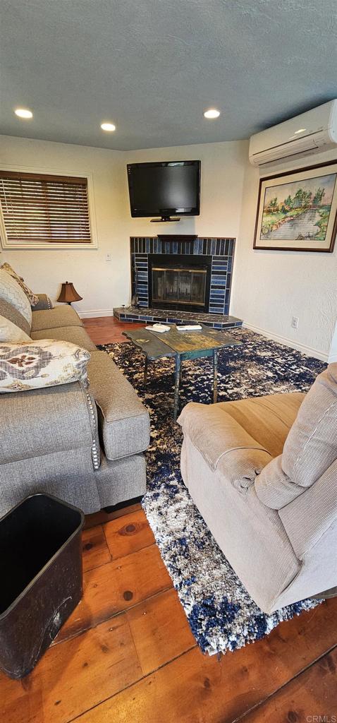405 Solana Real Fallbrook, CA 92028 - Photo 3 of 11 a living room with furniture and a flat screen tv