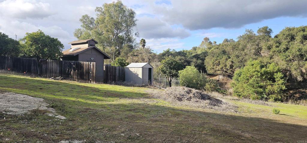 405 Solana Real Fallbrook, CA 92028 - Photo 10 of 11 a view of a backyard with large trees