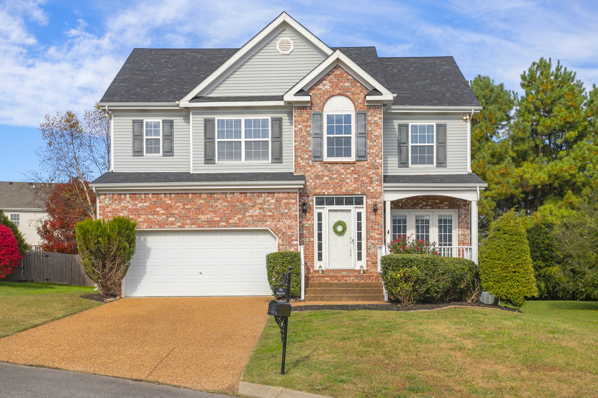 6004 Romain Court Spring Hill, TN 37174 - Photo 2 of 48 a front view of a house with a yard