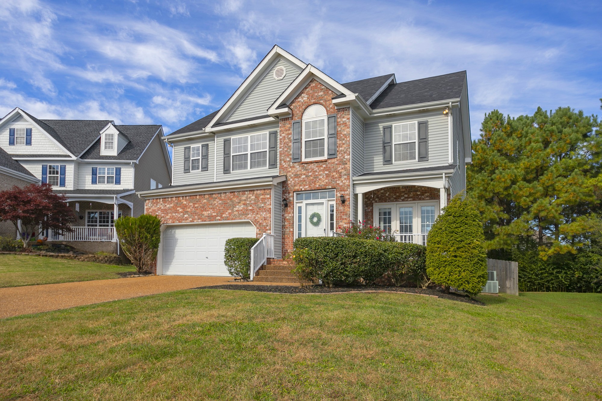 6004 Romain Court Spring Hill, TN 37174 - Photo 3 of 48 a front view of a house with a yard