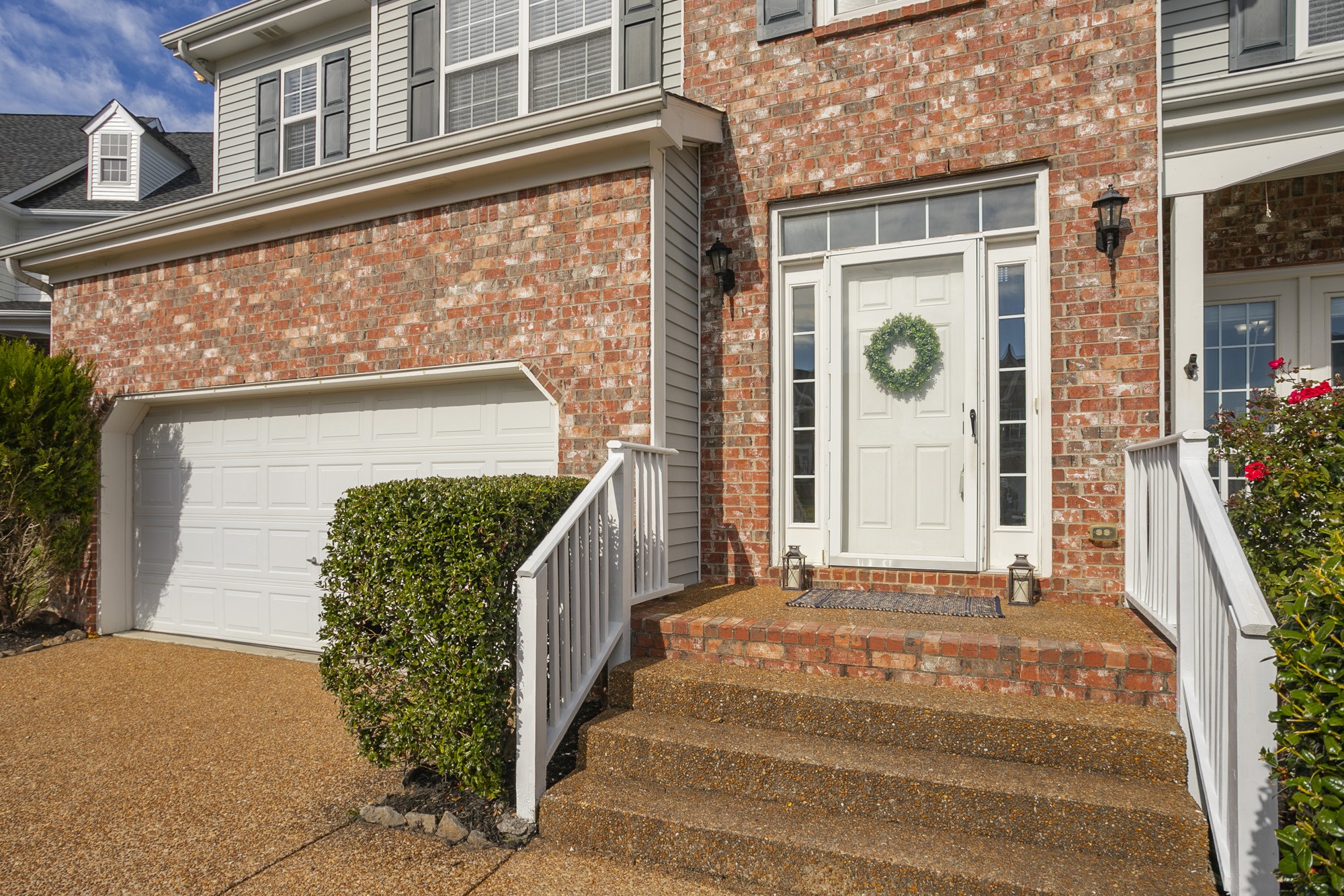 6004 Romain Court Spring Hill, TN 37174 - Photo 4 of 48 a front view of a house with a garden