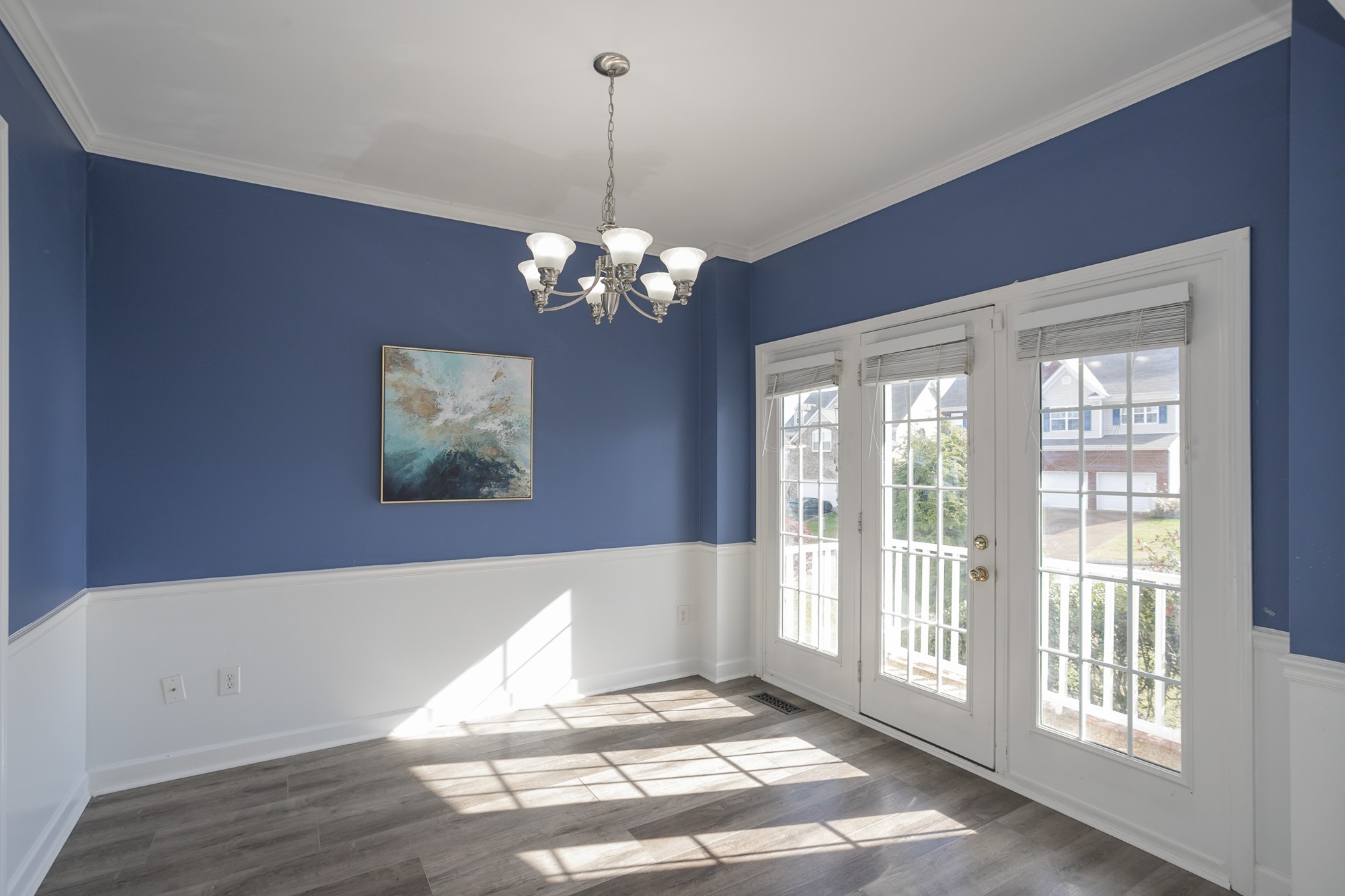 6004 Romain Court Spring Hill, TN 37174 - Photo 6 of 48 a view of an empty room with wooden floor and a window