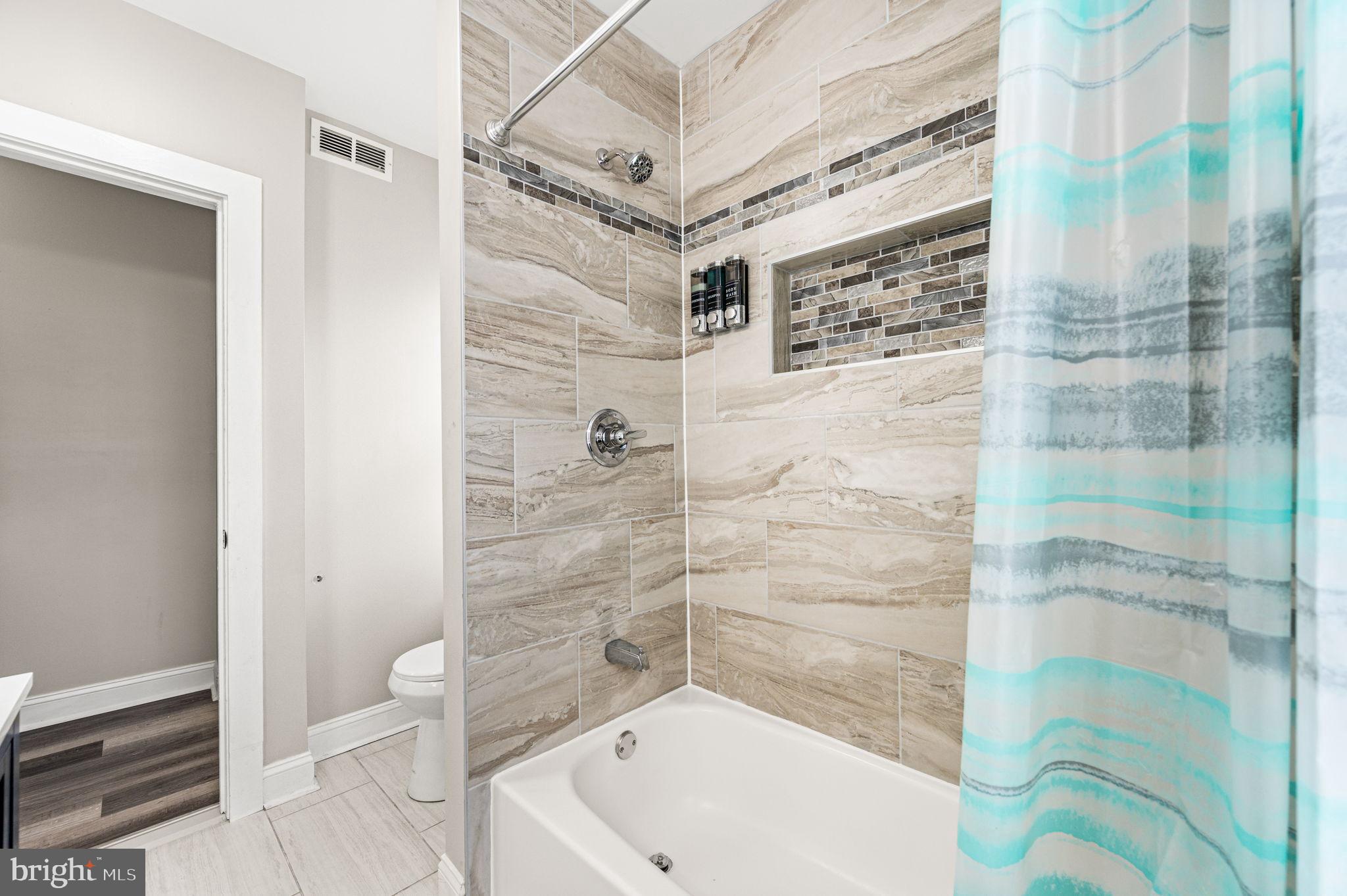 930 North 30th Street Philadelphia, PA 19130 - Photo 13 of 20 a bathroom with a shower and a toilet