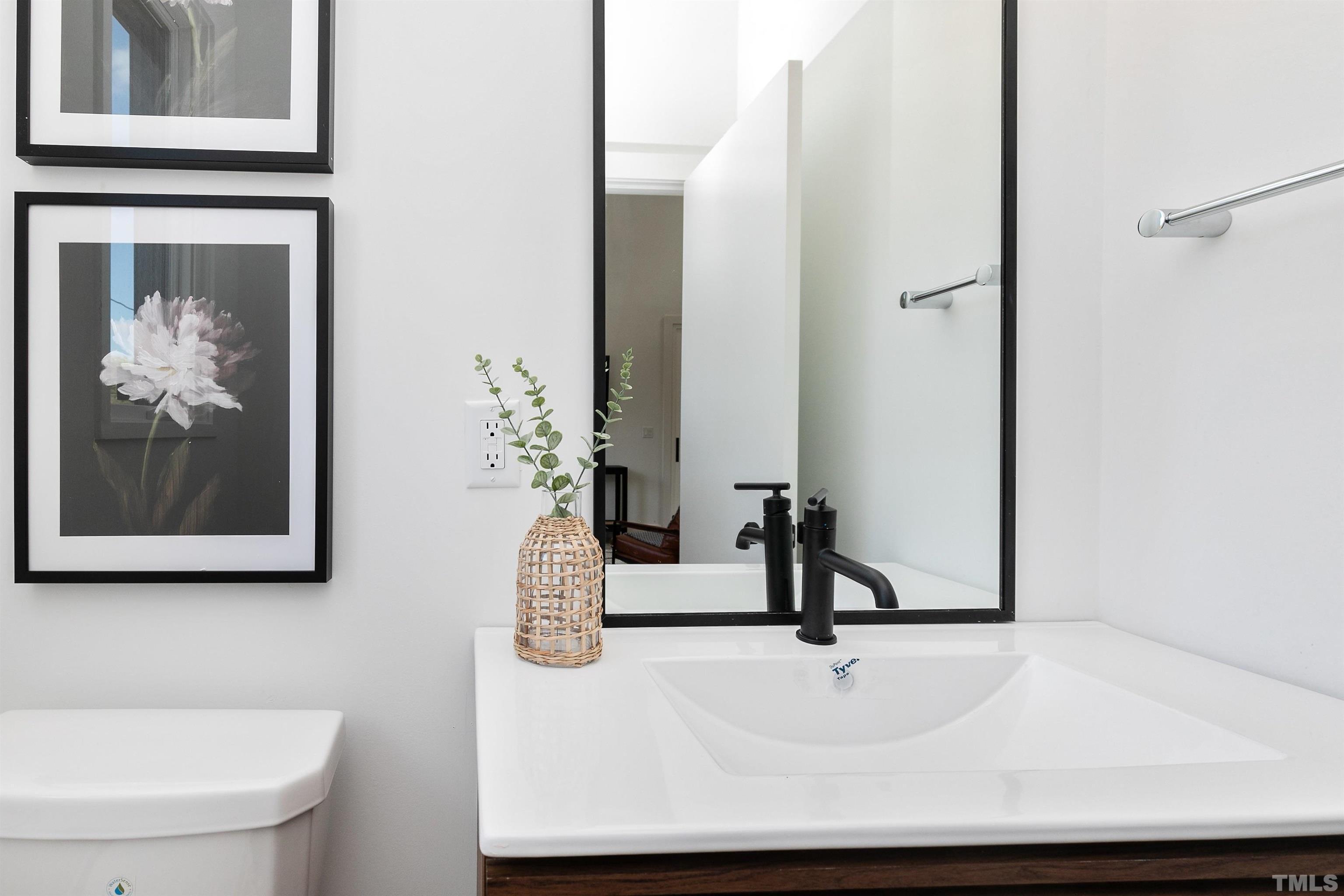 2159 Mayview Road, Unit B Raleigh, NC 27607 - Photo 26 of 29 a bathroom with a sink and a mirror