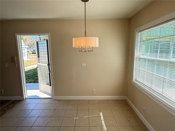 a view of a kitchen with a sink and a window