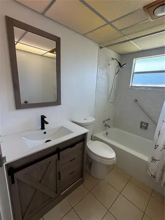 a bathroom with a sink a toilet and bathtub