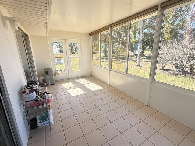 a view of a room with window and hardwood floor
