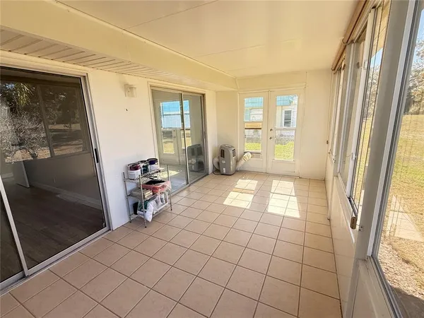 a view of a room with windows and entryway