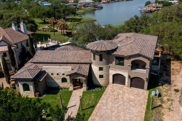 an aerial view of a house with yard swimming pool and outdoor seating