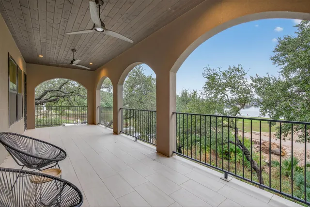 a view of a balcony with furniture
