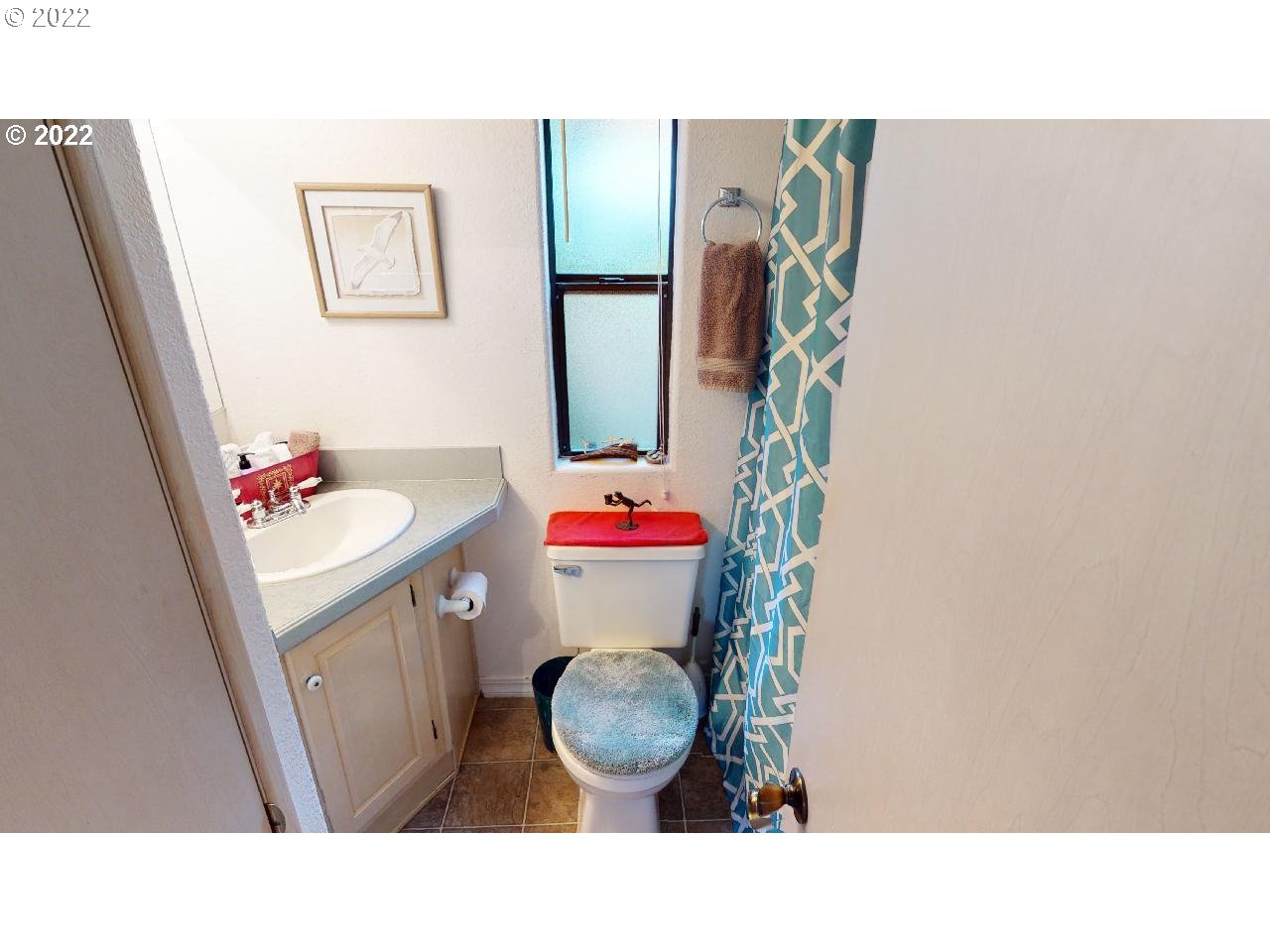 97748 North Bank Chetco River Road, Unit 11 Brookings, OR 97415 - Photo 20 of 32 a bathroom with a sink toilet and shower