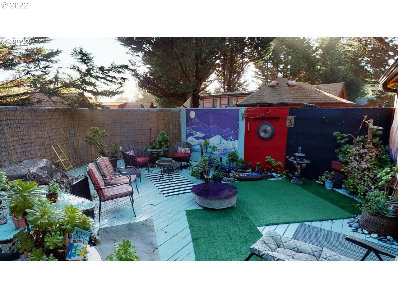 97748 North Bank Chetco River Road, Unit 11 Brookings, OR 97415 - Photo 27 of 32 a view of a backyard with sitting area