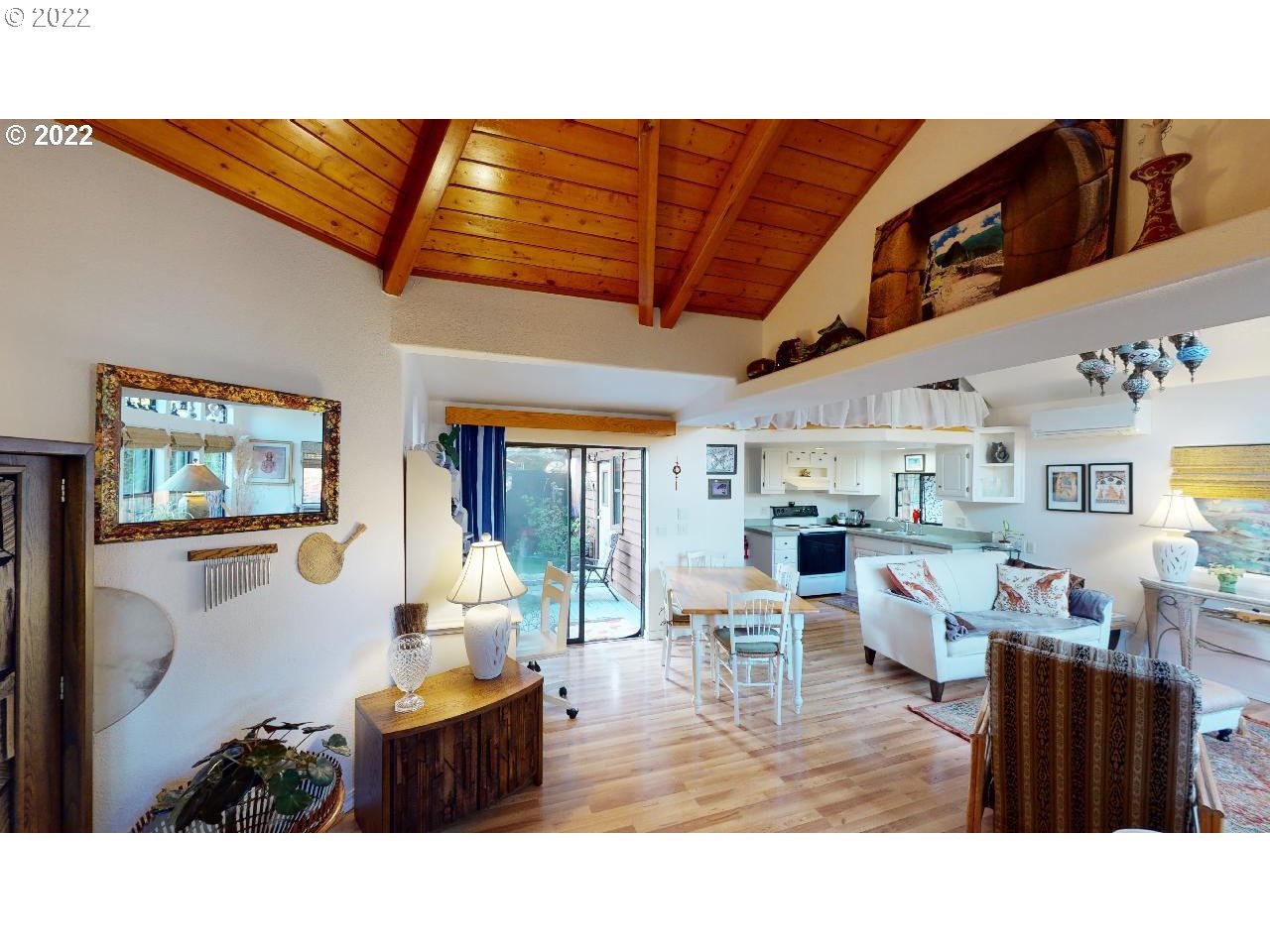97748 North Bank Chetco River Road, Unit 11 Brookings, OR 97415 - Photo 8 of 32 a living room with furniture and a flat screen tv