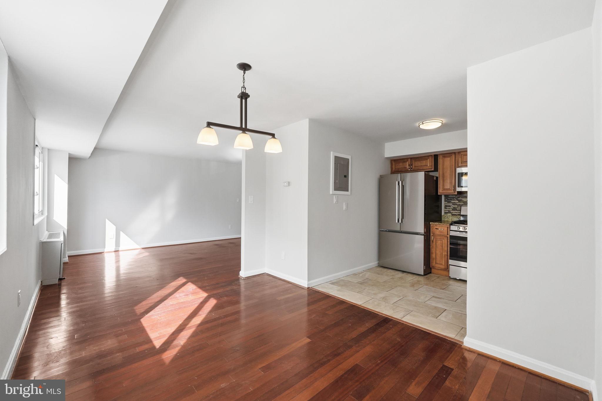 95 East Wayne Avenue, Unit 101 Silver Spring, MD 20901 - Photo 15 of 20 a view of empty room with wooden floor