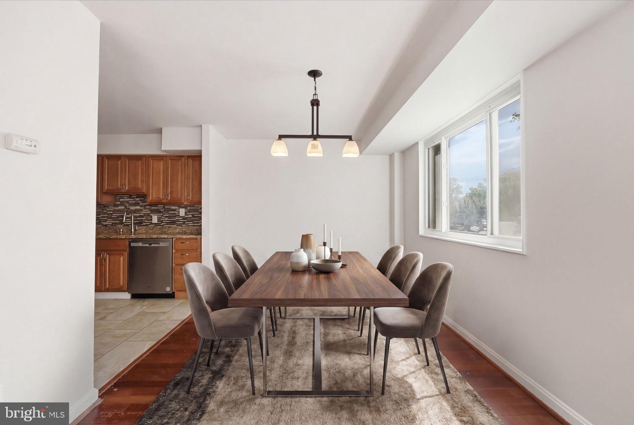 95 East Wayne Avenue, Unit 101 Silver Spring, MD 20901 - Photo 4 of 20 a dining room with furniture and window