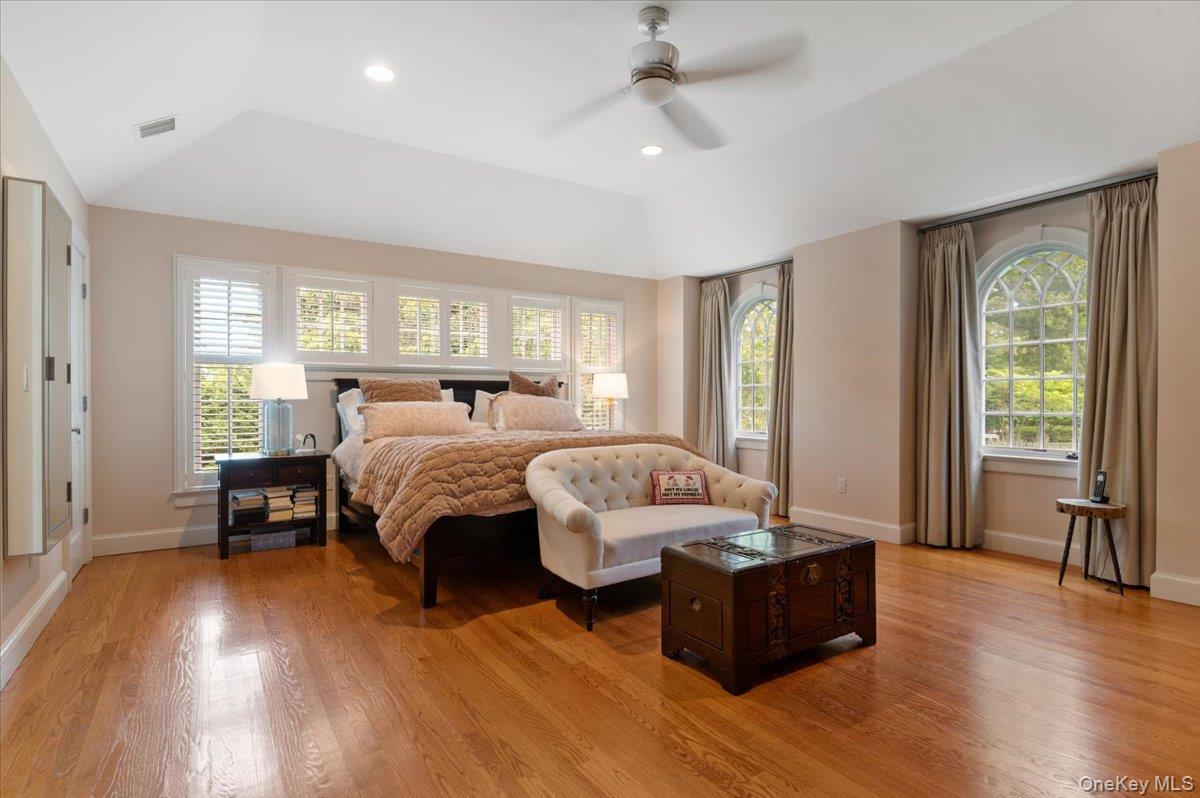 5 Fox Hunt Court Cold Spring Harbor, NY 11724 - Photo 18 of 42 Hardwood flooring and vaulted ceilings frame this expansive room