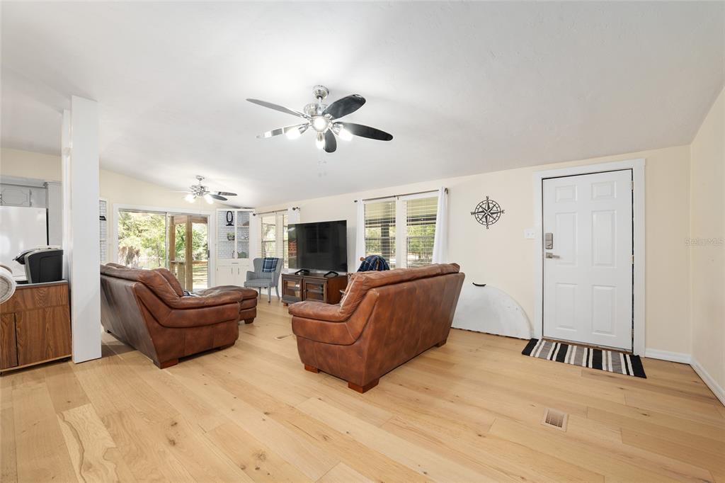 7870 Southwest 25th Place Bell, FL 32619 - Photo 64 of 99 a living room with furniture and a large window