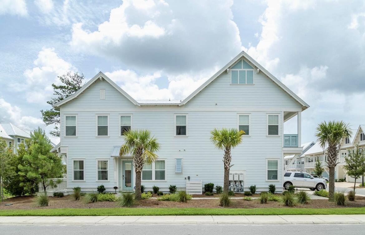 106 York Ln Inlet Beach, Unit A Inlet Beach, FL 32461 - Photo 1 of 28 a view of a white house with a big yard and potted plants