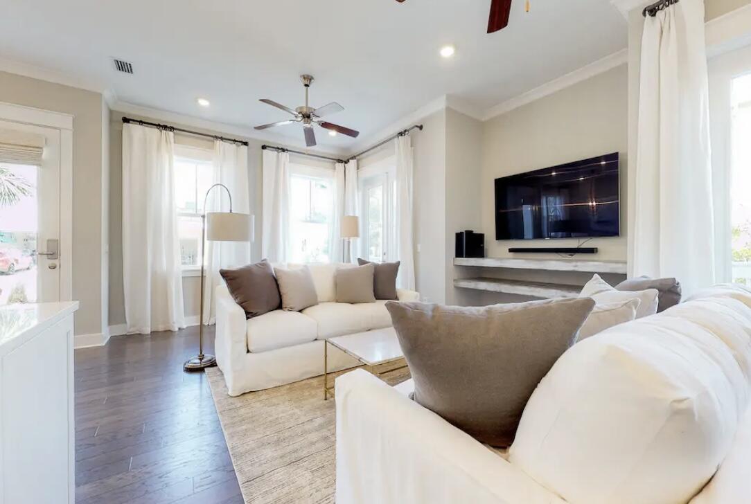 106 York Ln Inlet Beach, Unit A Inlet Beach, FL 32461 - Photo 11 of 28 a living room with furniture and a flat screen tv