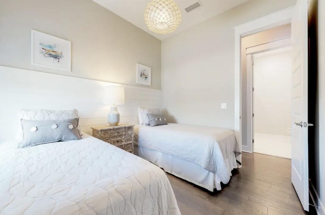 106 York Ln Inlet Beach, Unit A Inlet Beach, FL 32461 - Photo 18 of 28 a bedroom with two beds and a window