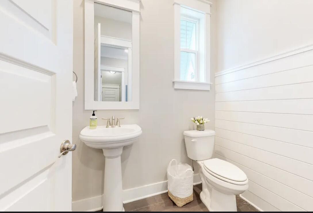 106 York Ln Inlet Beach, Unit A Inlet Beach, FL 32461 - Photo 23 of 28 a bathroom with a sink toilet and a mirror