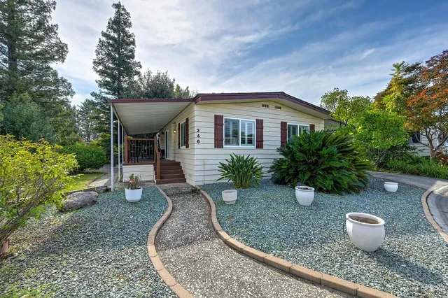 a front view of a house with garden