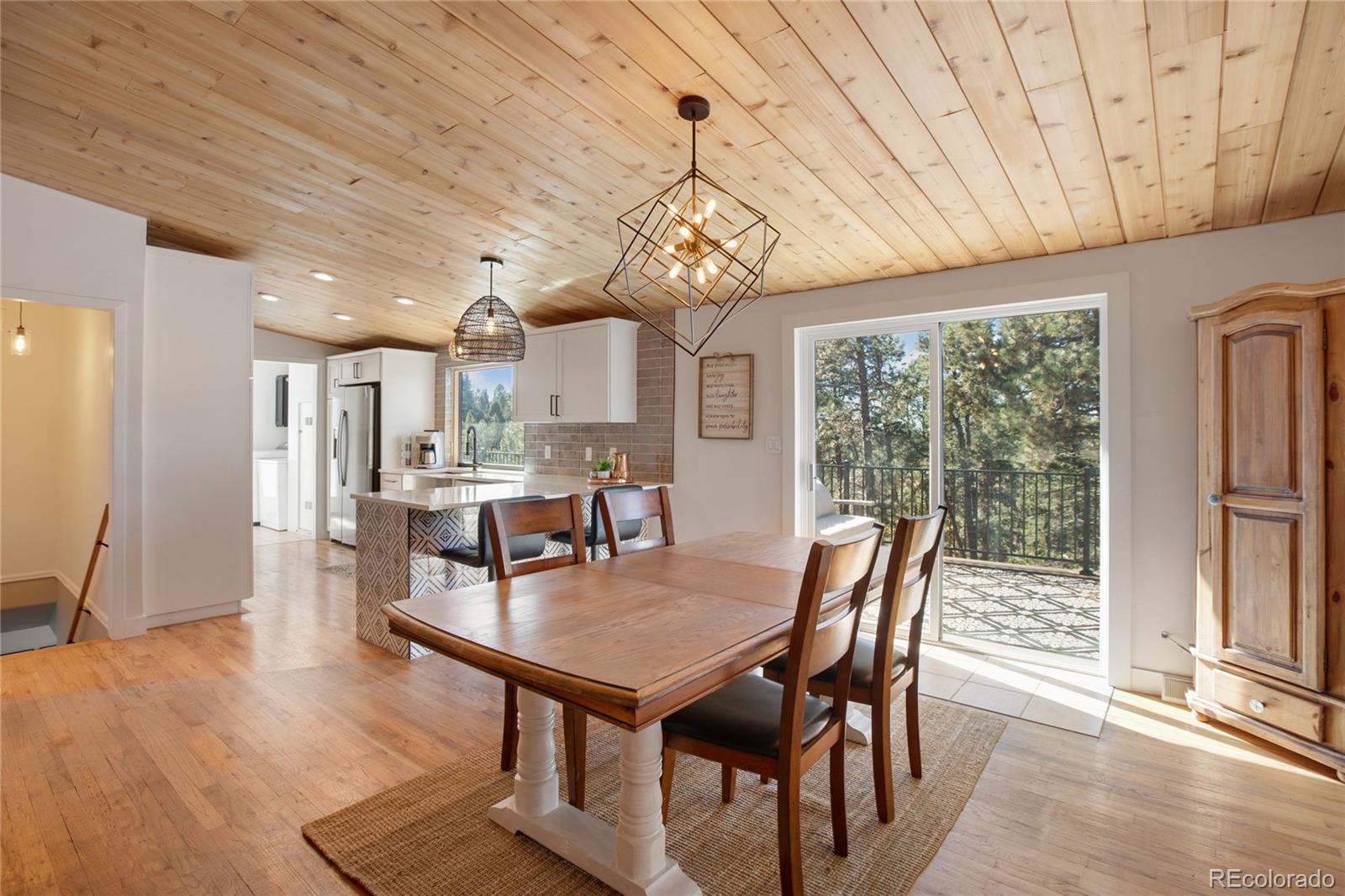 944 County Road 512 Divide, CO 80814 - Photo 21 of 49 a view of a dining room with furniture window and wooden floor