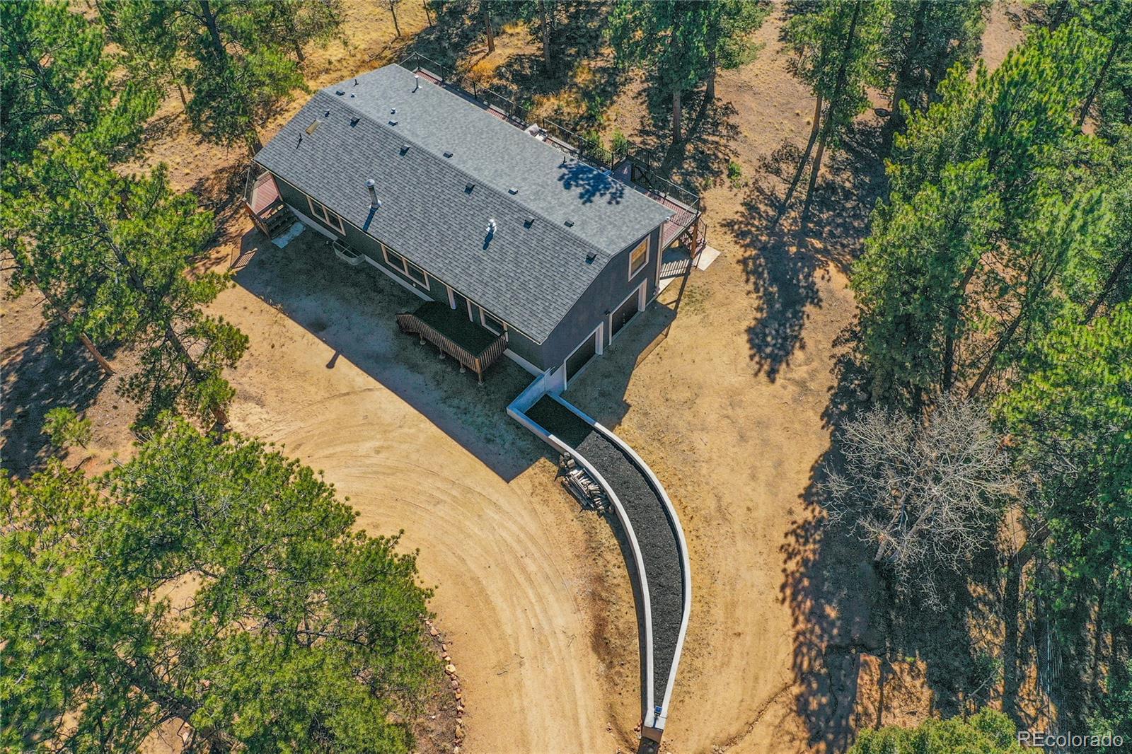 944 County Road 512 Divide, CO 80814 - Photo 45 of 49 a view of a house with a trees