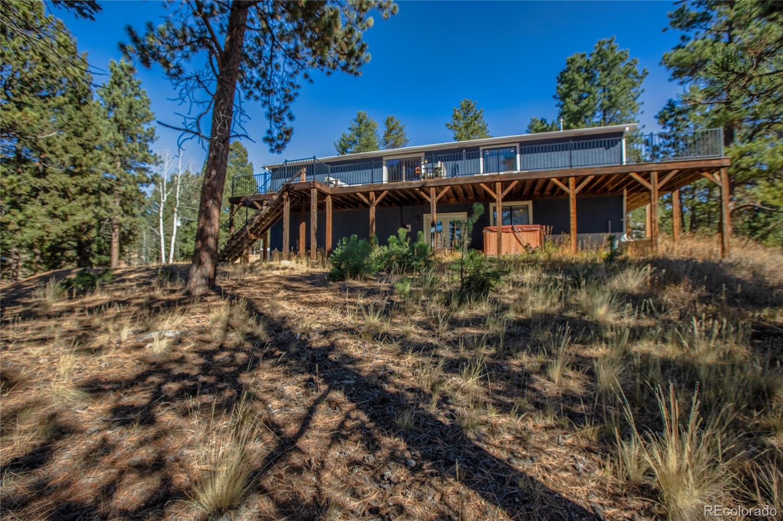 944 County Road 512 Divide, CO 80814 - Photo 46 of 49 a view of a house with yard and sitting area