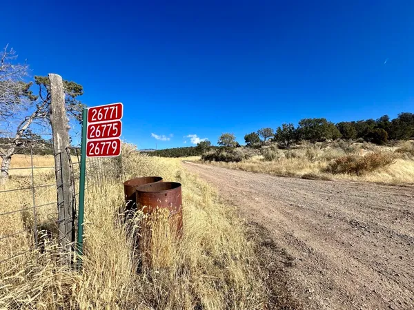 a view of a street with an outdoor space
