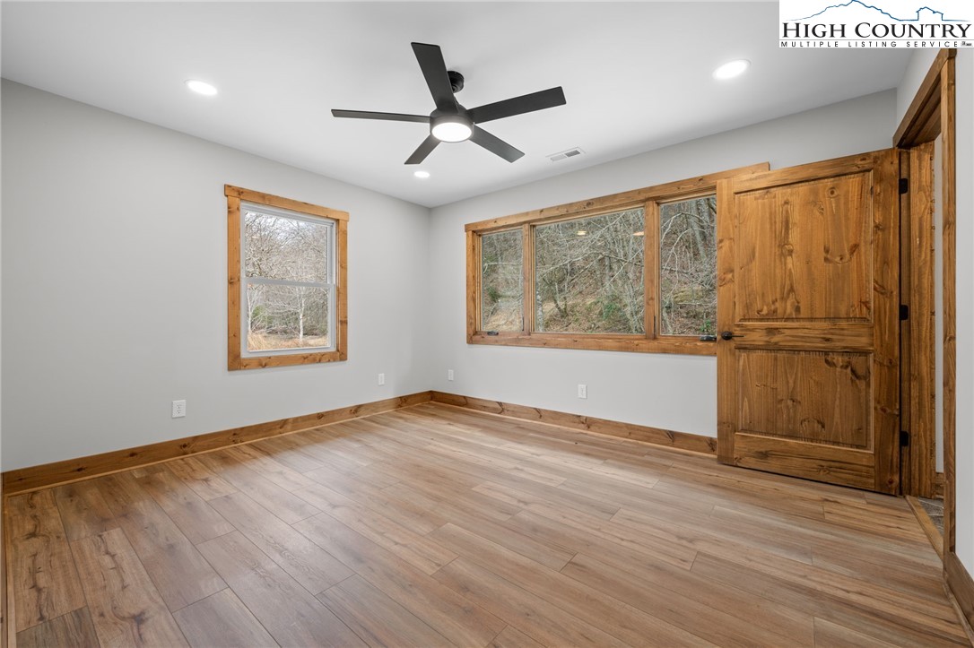 1904 Highway 194 Boone, NC 28607 - Photo 15 of 29 a view of an empty room with a window and wooden floor