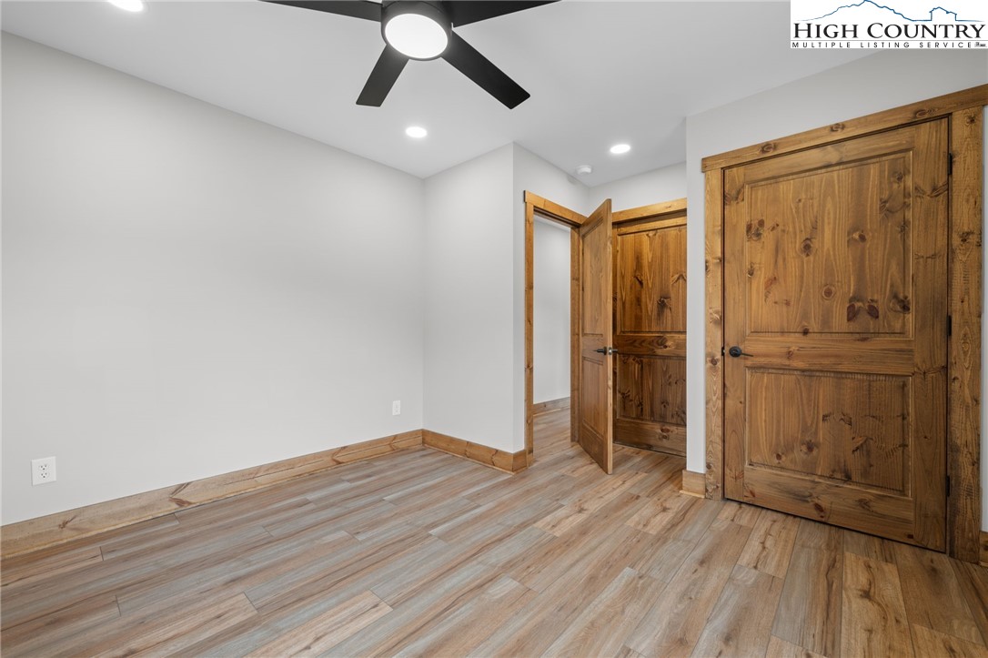 1904 Highway 194 Boone, NC 28607 - Photo 17 of 29 a view of an empty room with wooden floor and a window