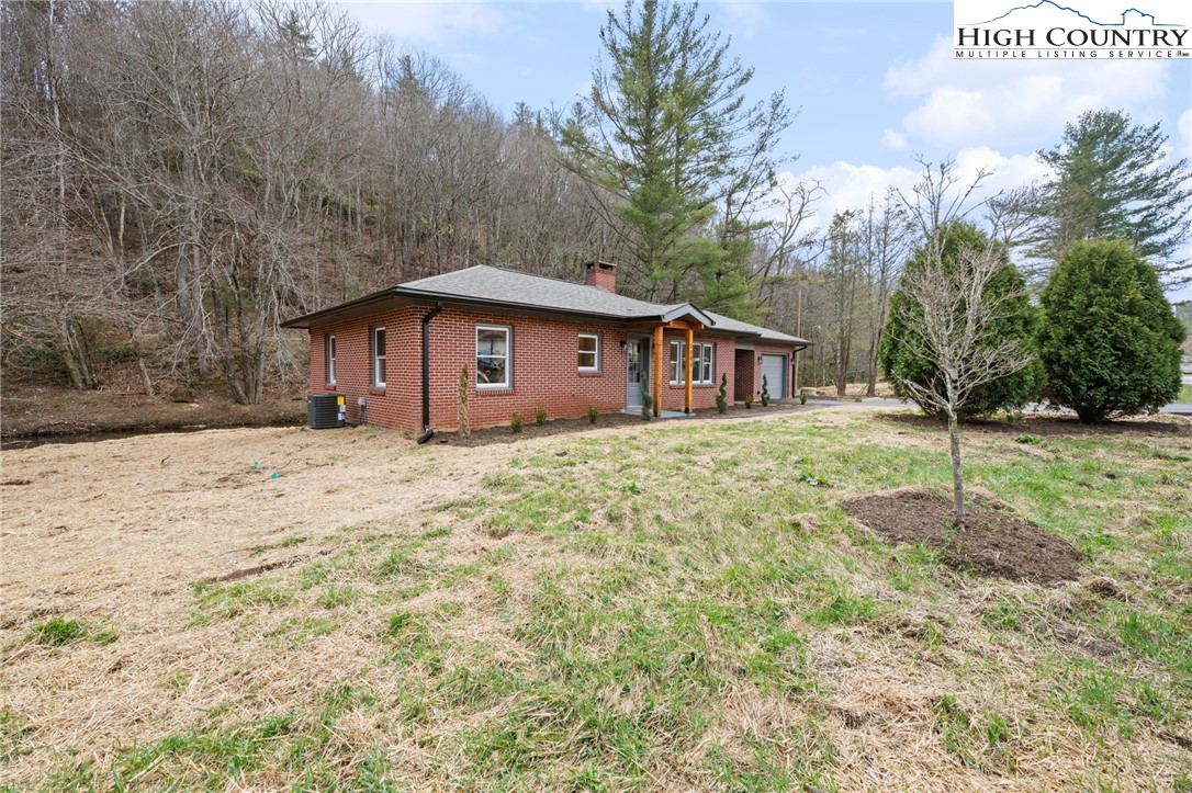 1904 Highway 194 Boone, NC 28607 - Photo 21 of 29 a front view of a house with a yard