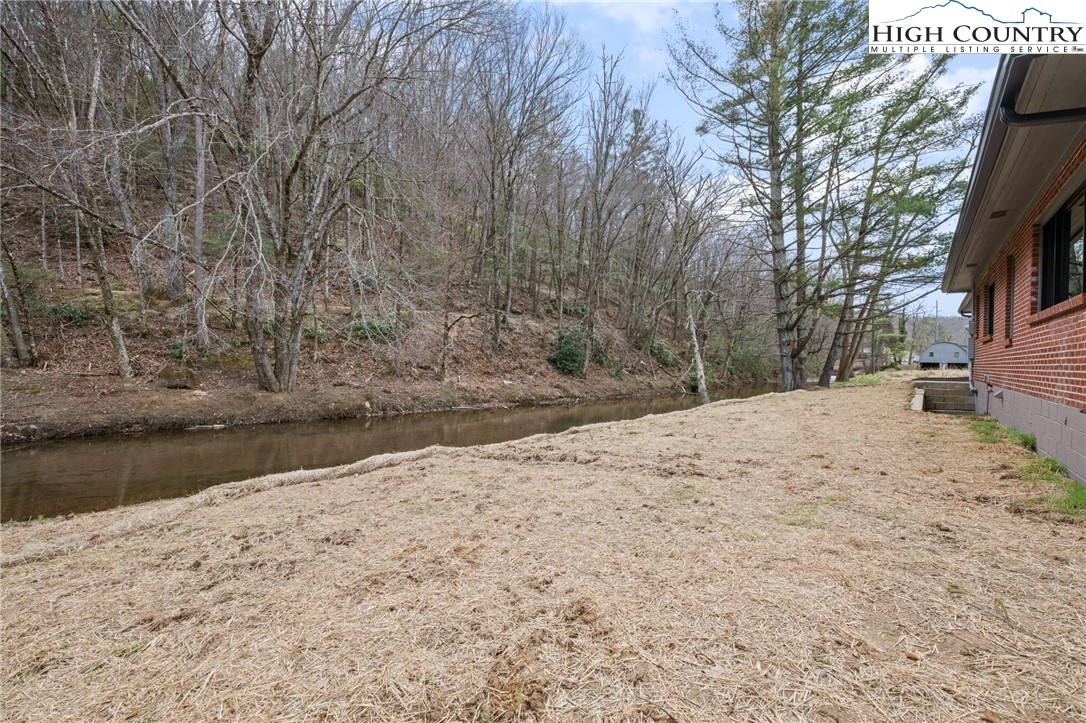 1904 Highway 194 Boone, NC 28607 - Photo 22 of 29 a view of a yard with snow on the road