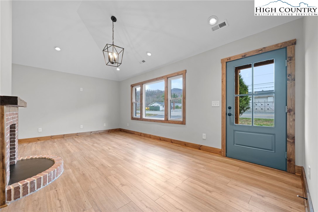 1904 Highway 194 Boone, NC 28607 - Photo 6 of 29 a view of an empty room with a window and wooden floor