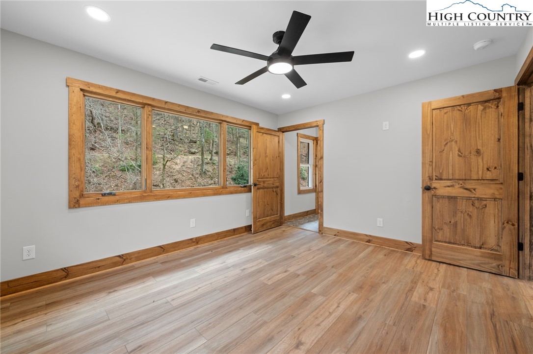 1904 Highway 194 Boone, NC 28607 - Photo 10 of 29 a view of an empty room with a window and wooden floor