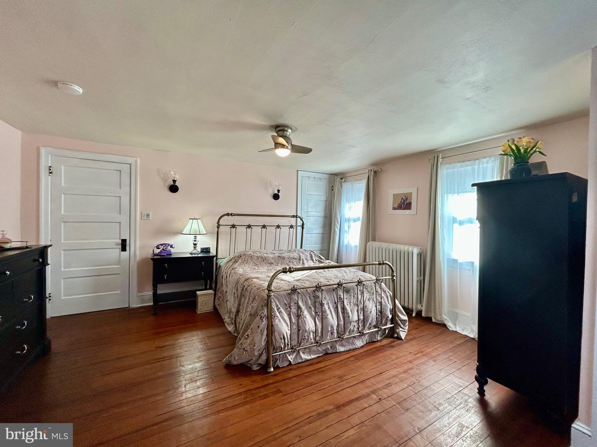2415 Second Street Pike Newtown, PA 18940 - Photo 25 of 51 a bedroom with a bed and wooden floor
