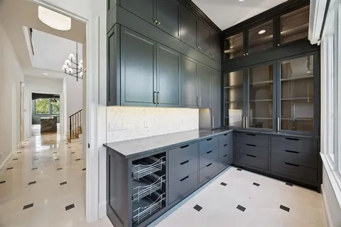 a bathroom with a shower and a sink