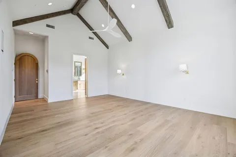 a spacious bathroom with a double vanity sink large mirror and a bathtub